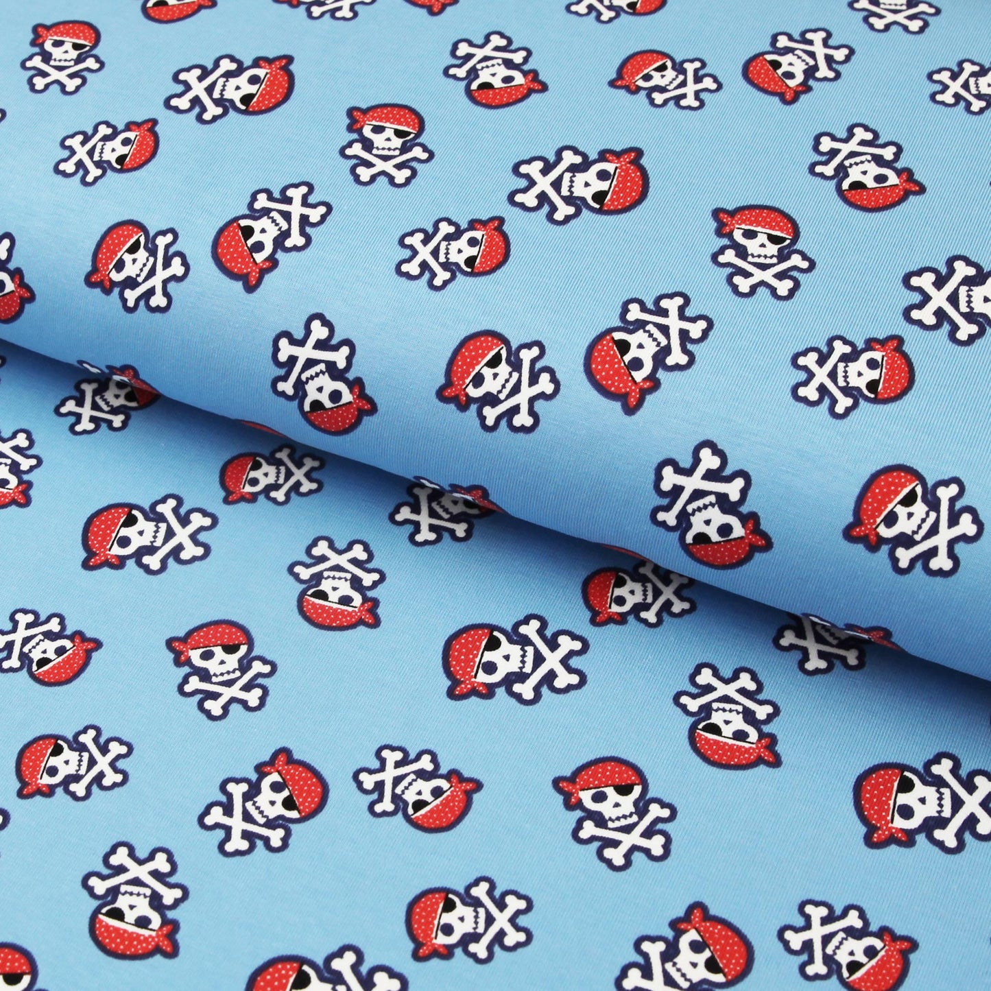 Baumwolljersey "Piraten Totenköpfe auf blau" - Jersey Stoff mit Skulls Seeräuber - Stoffe Kudellino - Bündchenstoffe, Jersey Stoffe und mehr...