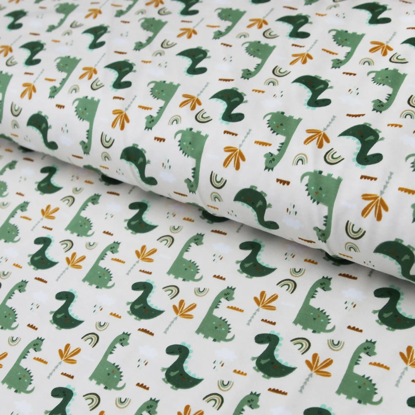 Baumwolljersey "grüne Dinos auf beige" Stoffe Kudellino