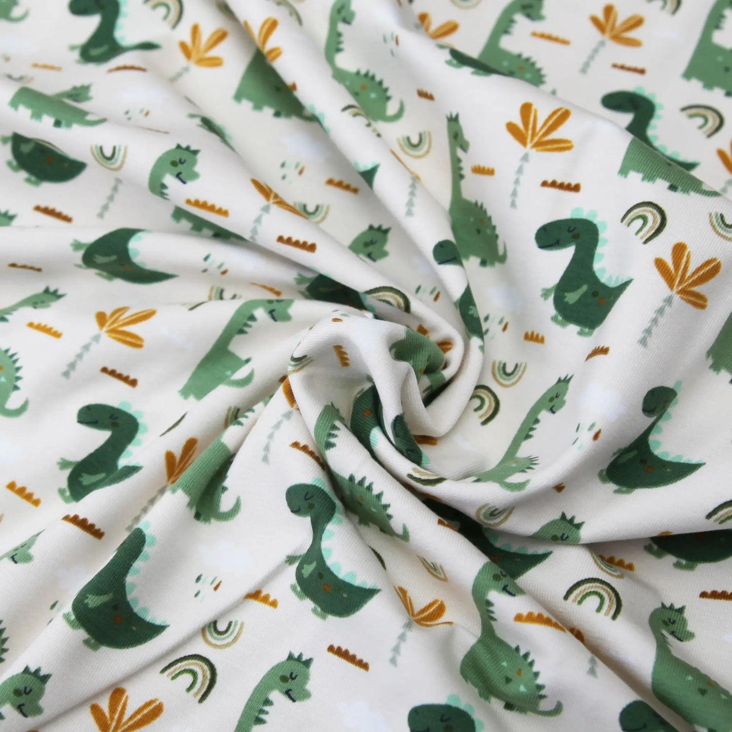 Baumwolljersey "grüne Dinos auf beige" Stoffe Kudellino