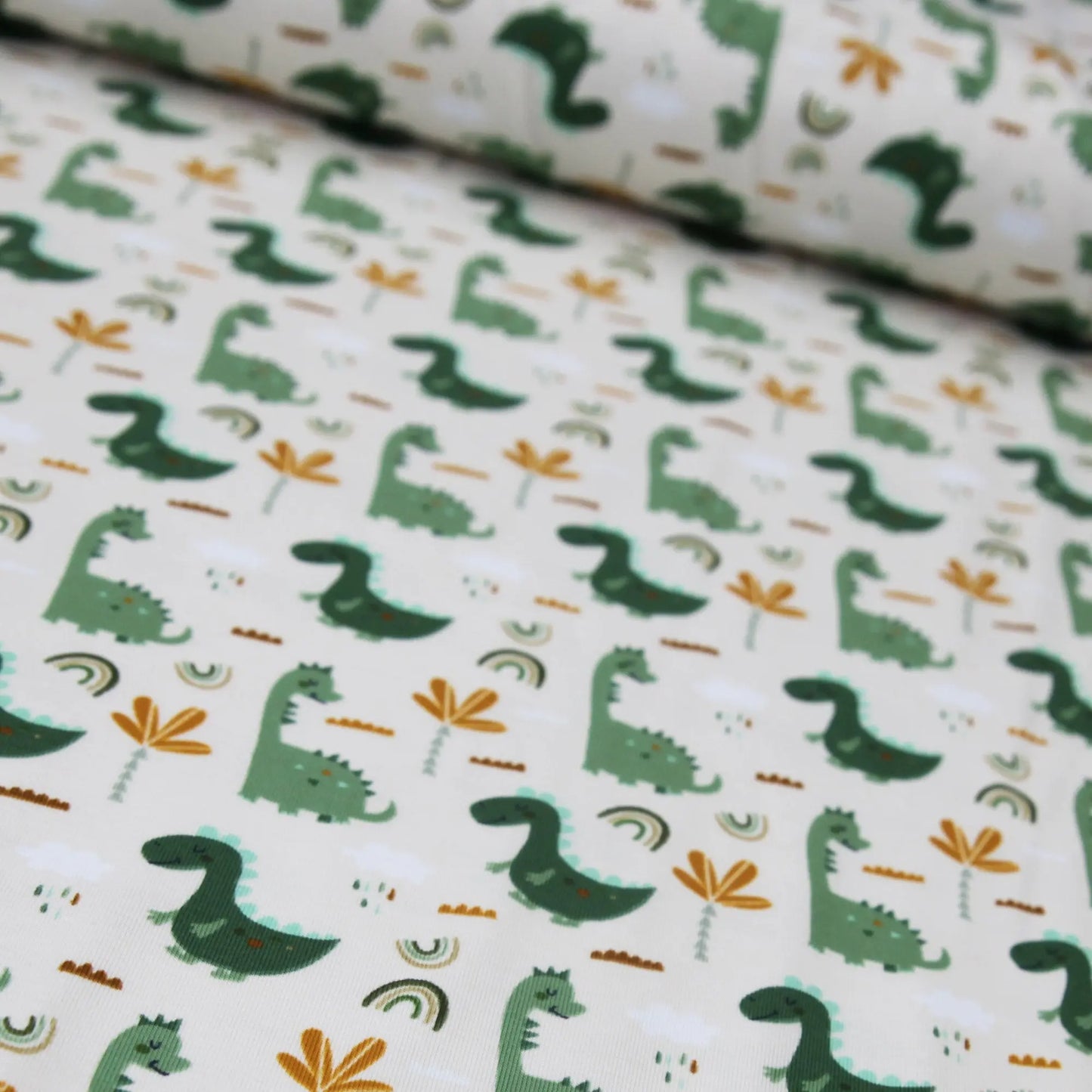 Baumwolljersey "grüne Dinos auf beige" Stoffe Kudellino