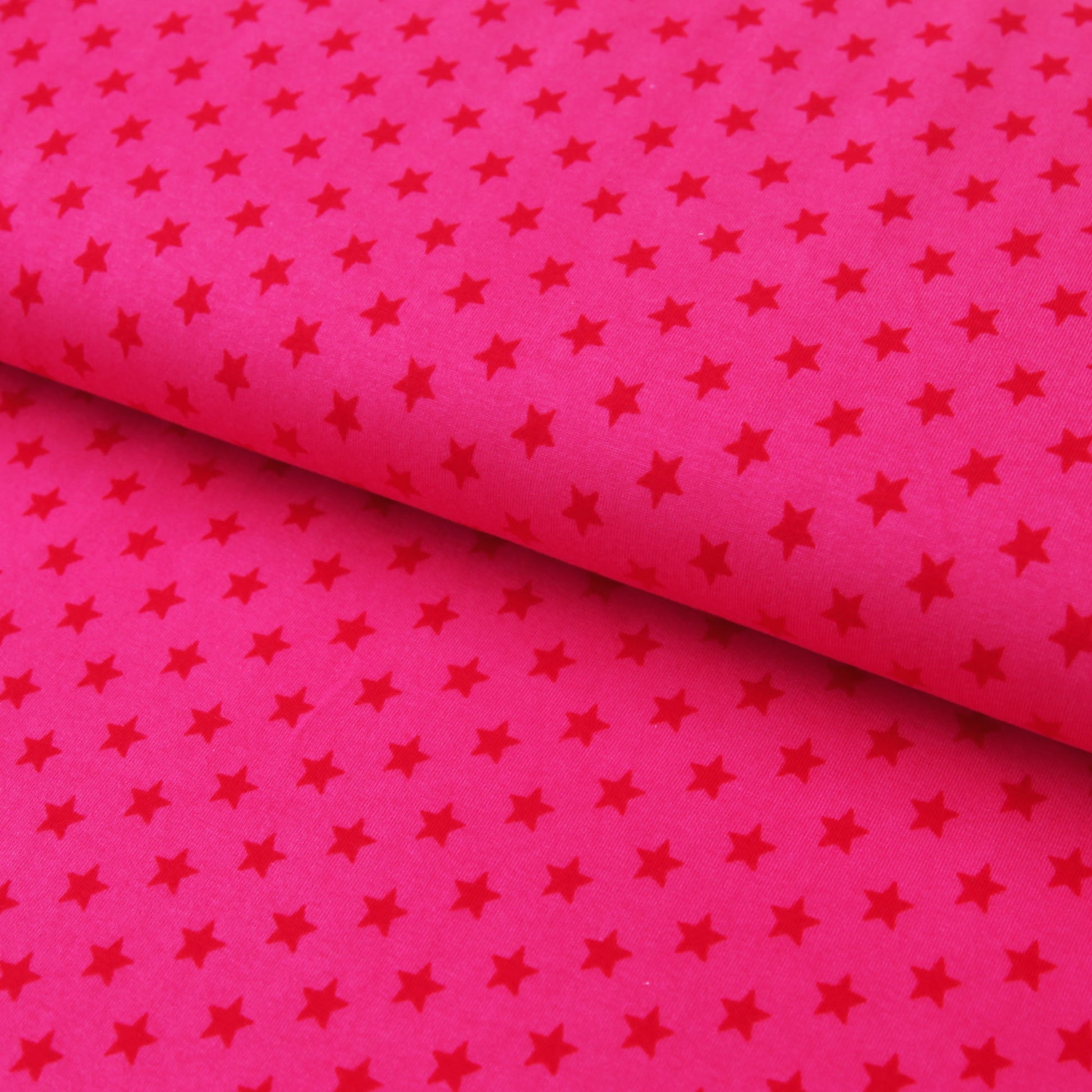 Baumwolljersey "rote 1cm Sterne auf fuchsia" - Jersey Stoff in pink