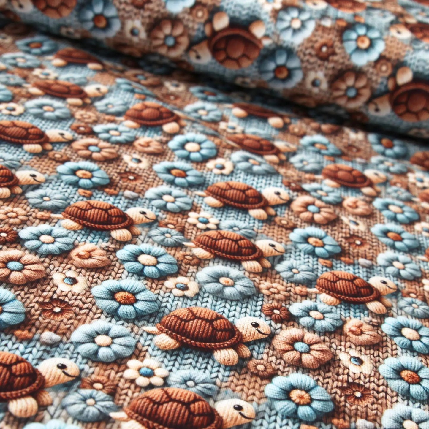 Baumwolljersey "Schildkröten" - Jersey Stoff mit gestrickten Schildkröten und Blüten  Stoffe Kudellino