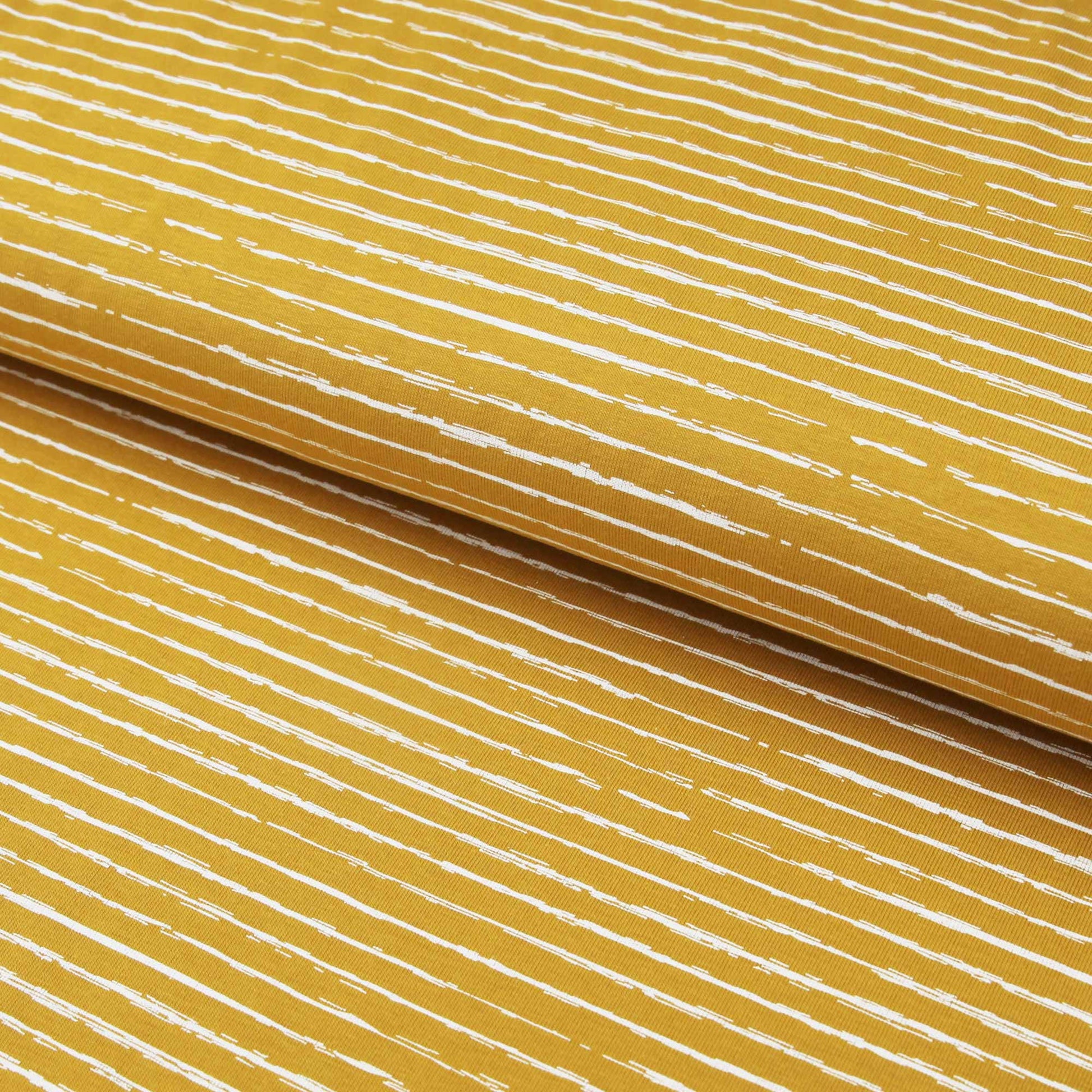 Baumwolljersey "unregelmäßige Streifen auf ocker" - Jersey StoffJersey BedrucktStoffe KudellinoStoffe Kudellino